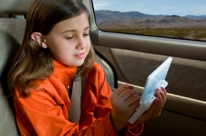 Kid playing game in car